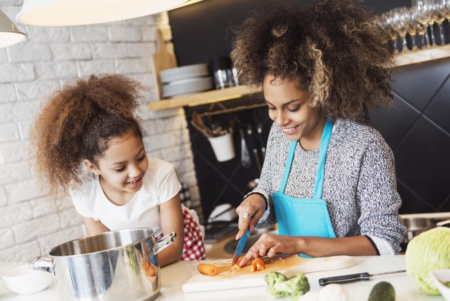 Mother and Daughter Cooking Healthy Dinner