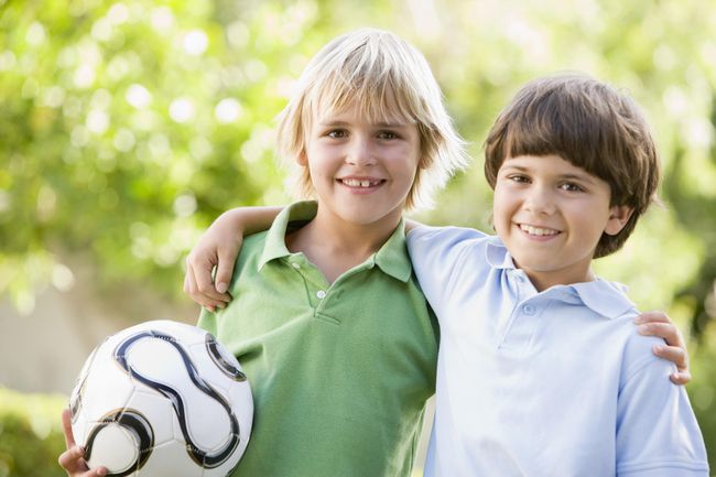 Friends Holding a Soccer Ball