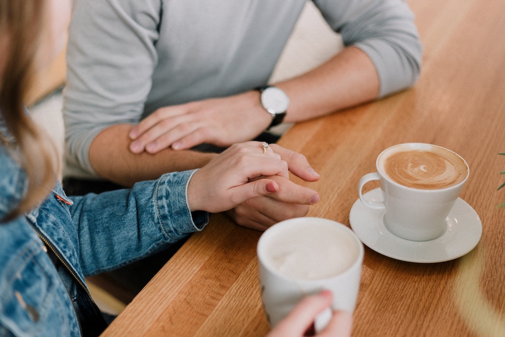 engaged couple discussing wedding budget